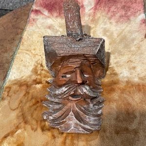 Handcrafted wooden Santa face amazingly used the part of the tree with a branch